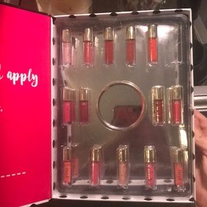 14 mini lipglosses and mini circle mirror